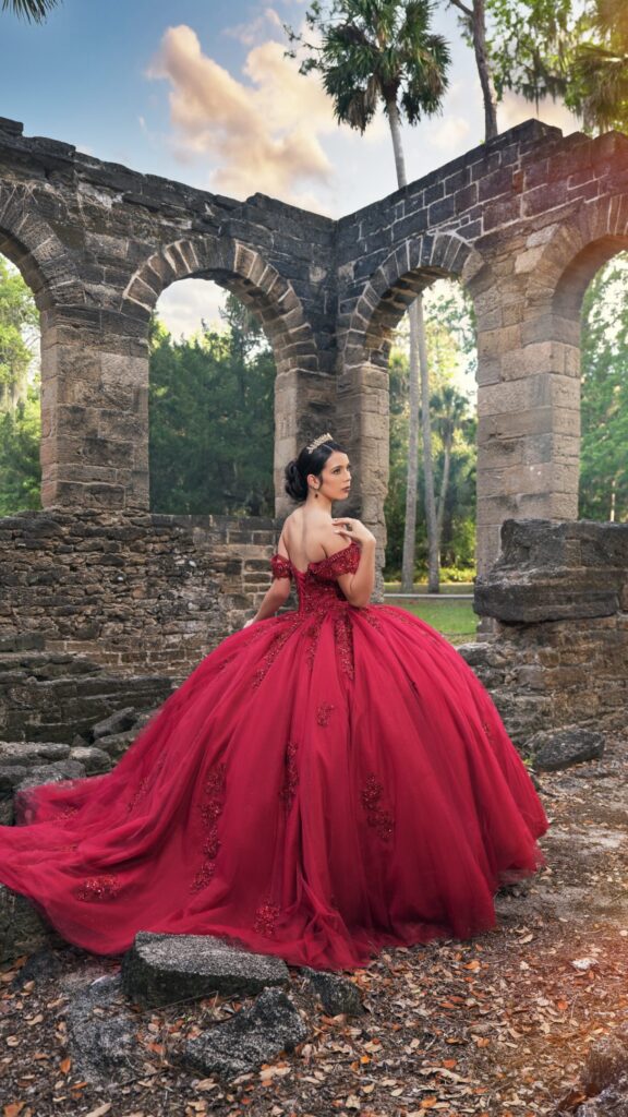 Burgundy off-shoulder sequin lace quinceañera ball gown available to rent in Orlando, FL