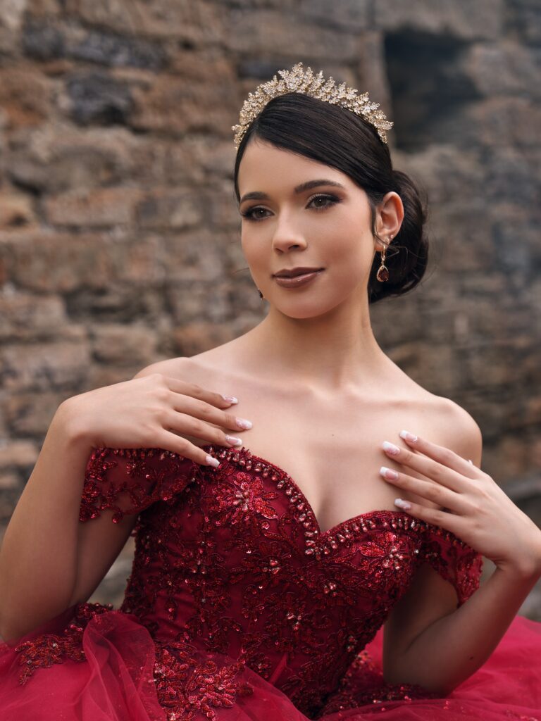 Burgundy sequin lace quinceañera ball gown with tiara available to rent in Orlando, FL