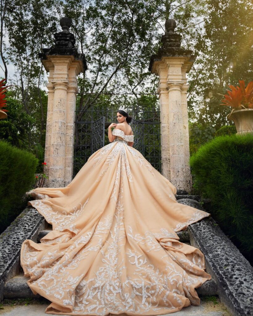 Champagne quinceañera ball gown with long train available to rent in Orlando, FL