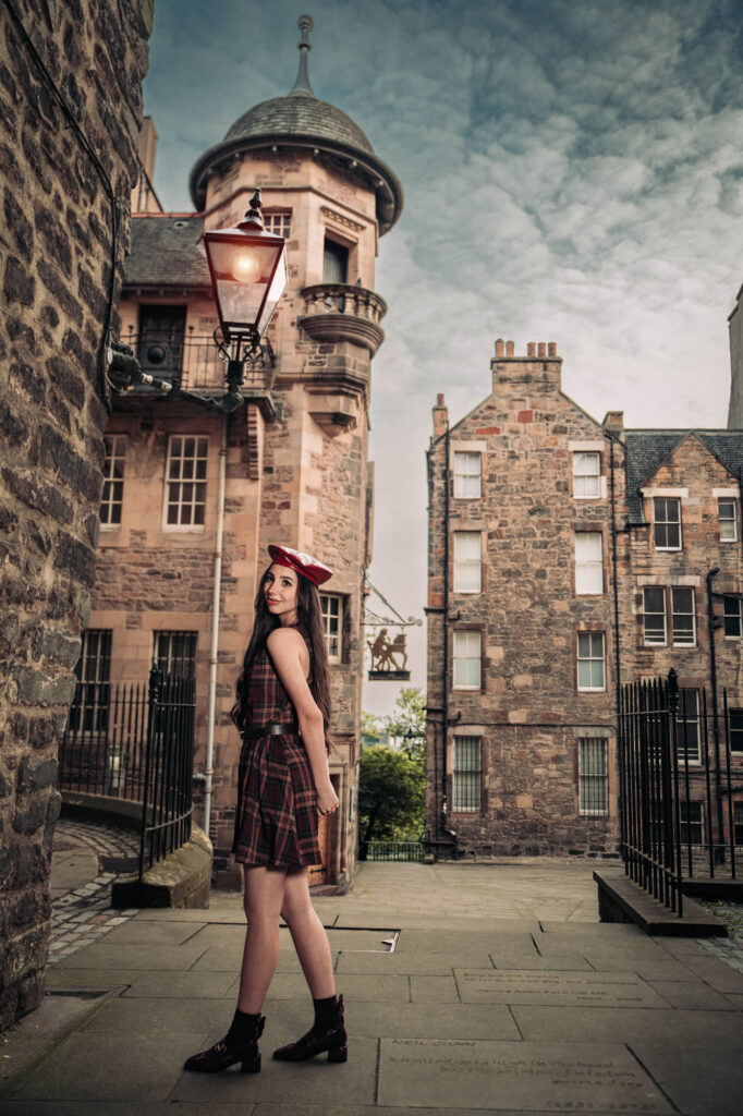 Quinceañera photoshoot in a tartan skirt and beret in Edinburgh's Old Town