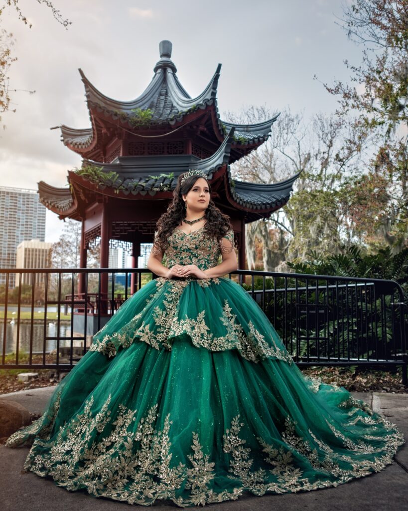 Emerald green and gold quinceañera dress available to rent in Orlando, FL