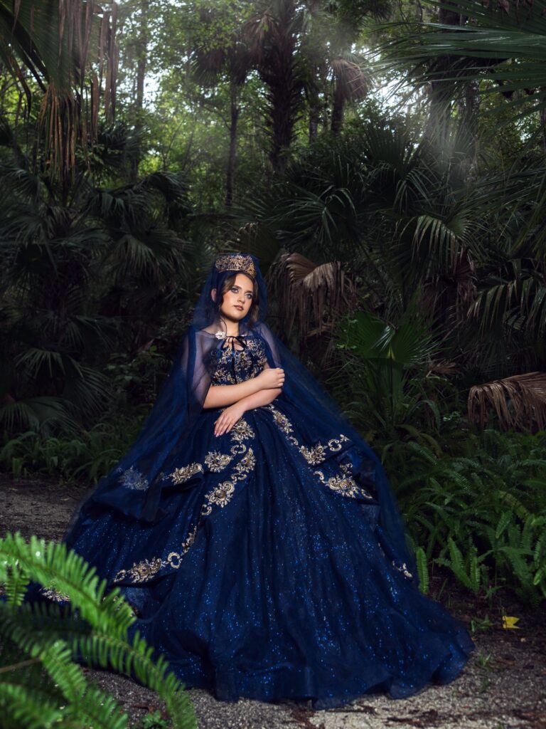 Navy blue quinceañera dress with cape available to rent in Orlando, FL