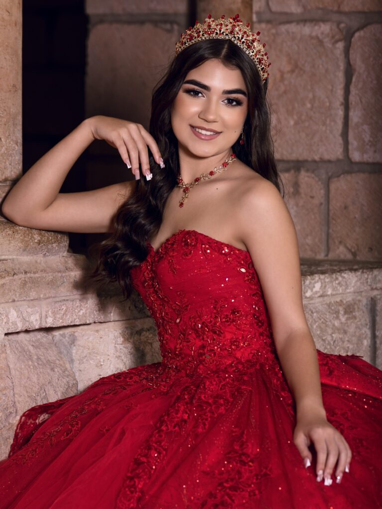 Red quinceañera dress with gold tiara available to rent in Orlando, FL